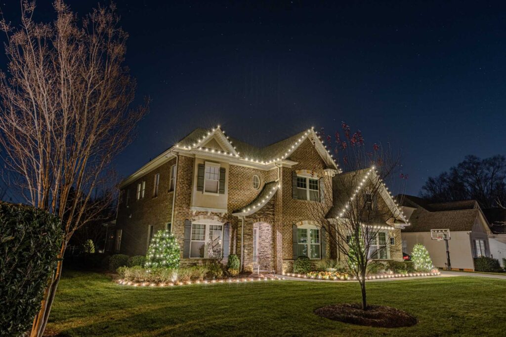 Elegant holiday lighting installed on a residential property